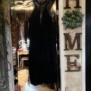 1X black tulle dress with split. A158